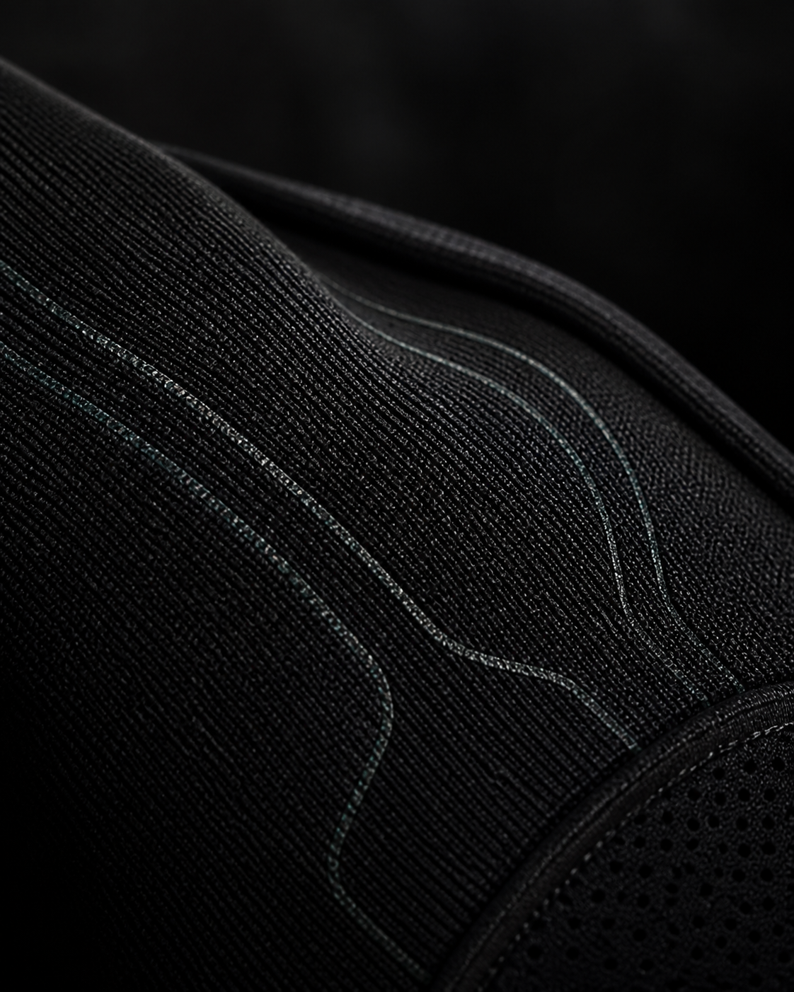 Concept rendering of black technical knit with integrated sensor pathways.